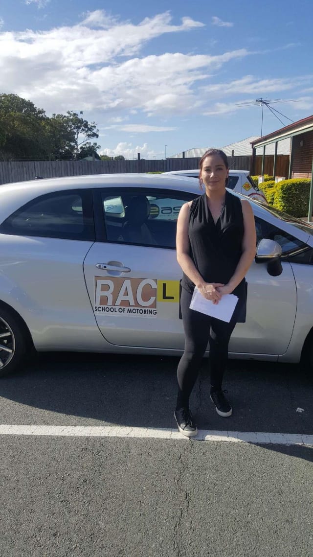 Learner beside a silver RAC learner car